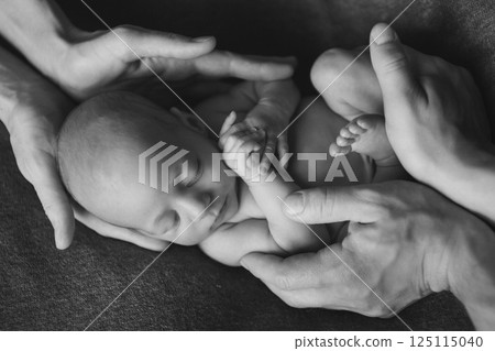A newborn baby is wrapped in diapers with a wool cap in a basket. Swaddling, maternity hospital, family, ivf, life planning, parenting. A mother's love for her child. Baby food. High quality photo A newborn baby is wrapped in diapers with a wool cap in a basket. Swaddling, maternity hospital, family, ivf, life planning, parenting. A mother's love for her child. Baby food. High quality photo 125115040