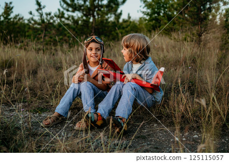 Friends brothers, boys plays, talks aviation. Handmade wooden vintage plane toy 125115057