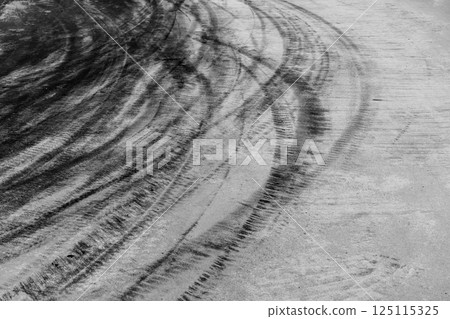 Car tire mark on race track, Abstract black car tire mark on race track, Abstract texture background car tire mark skid mark on asphalt circuit, Tire track on road race speed track circuit. 125115325