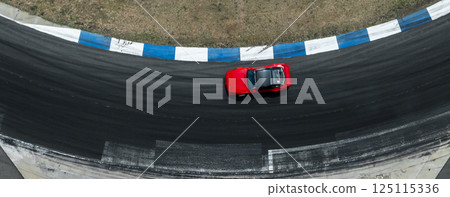 Top view car drift on asphalt race track with lot of smoke from burning tires rubber, Drift motor sport car drift race, Professional driver drift car on asphalt race track. Top view car drift on asphalt race track with lot of smoke from burning tires rubber, Drift motor sport car drift race, Professional driver drift car on asphalt race track. 125115336