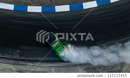 Motorsport car drift on asphalt race track with lot of smoke from burning wheel tires rubber, Drift motorsport car drift race, Professional driver drift car on asphalt race track, Car motion blurred. 125115415