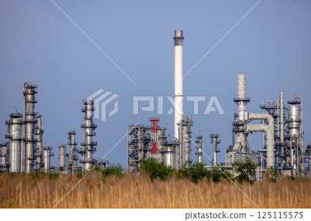 Oil and gas refinery industrial factory plant with blue sky background at oil and gas refinery zone, Business oil and gas industrial plant, Oil and gas refinery petrochemical plant industrial. Oil and gas refinery industrial factory plant with blue sky background at oil and gas refinery zone, Business oil and gas industrial plant, Oil and gas refinery petrochemical plant industrial. 125115575