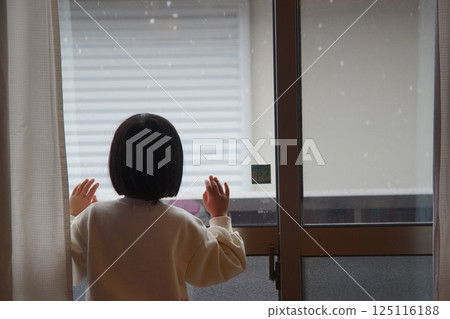 A woman looking out the window A woman looking out the window 125116188