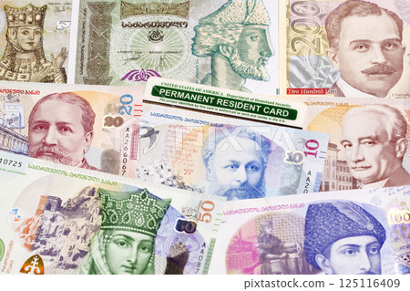 American permanent resident card on Georgian money American permanent resident card on Georgian money 125116409