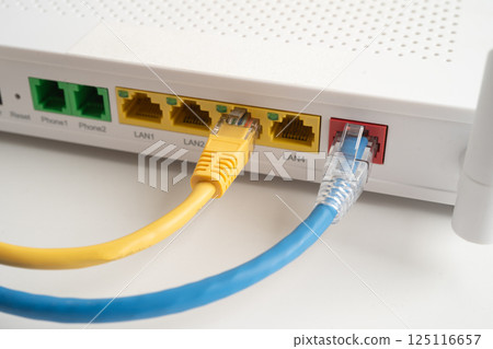 Ethernet cable with wireless router connect to internet service provider internet network. 125116657