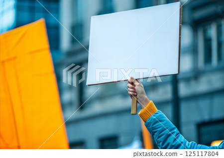 Hand Holding Blank Sign at Protest Hand Holding Blank Sign at Protest 125117804