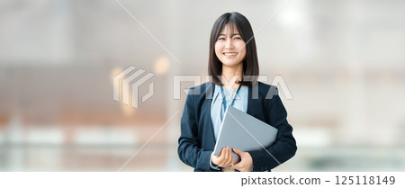 Smiling woman/businesswoman with a laptop 125118149