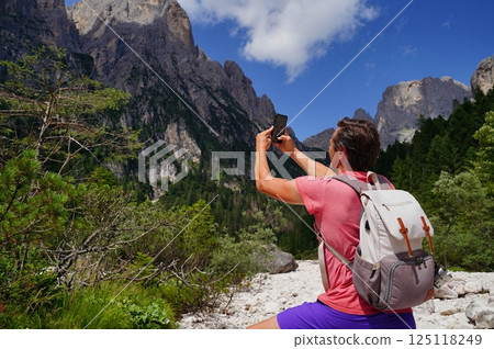 Hiker Photographs Majestic Mountain Scenery Hiker Photographs Majestic Mountain Scenery 125118249
