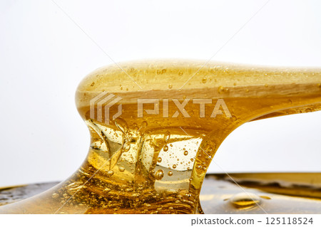 Photo of a sugar paste for depilation hair removal procedure. Texture. 125118524