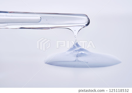 Pipette with delicate blue serum close-up. 125118532