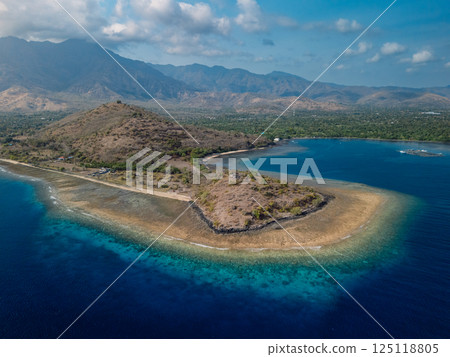 Savannah landscape with blue sea and mountains in Pemuteran, Bali. 125118805