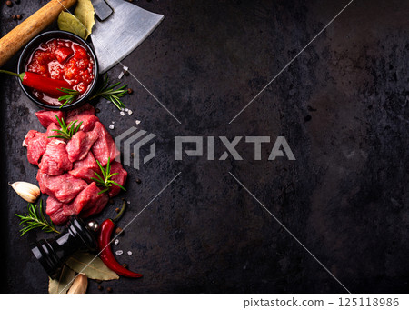 Raw beef meat and ingredients for cooking 125118986