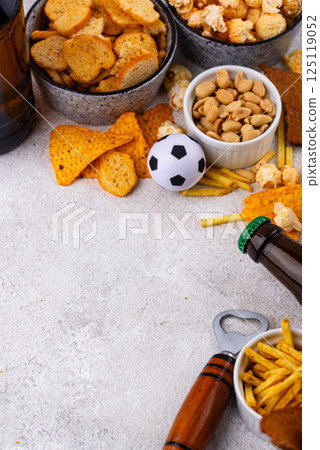 Beer and different snacks for Superbowl or football party Beer and different snacks for Superbowl or football party 125119052