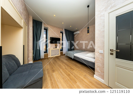 Hotel Room Interior Design: Modern Apartment Bedroom, Comfortable Accommodation, Luxury Stay. Hotel Room Interior Design: Modern Apartment Bedroom, Comfortable Accommodation, Luxury Stay. 125119110