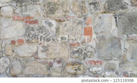 Old stone wall with a mixture of colors Old stone wall with a mixture of colors 125119306