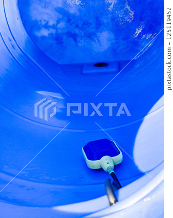 Water or liquid level sensor in a large blue plastic container 125119452