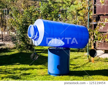 Cleaning of a drinking water container. A blue plastic container for clean water is drying in sun. 125119454