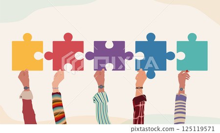 Different hands holding puzzle pieces as symbol of unity teamwork inclusion and collaboration 125119571
