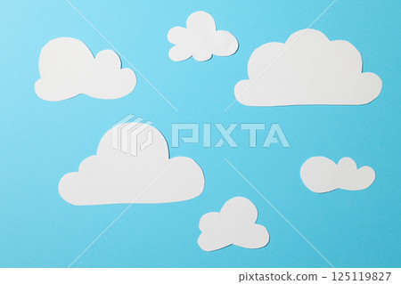 white paper clouds on blue background 125119827
