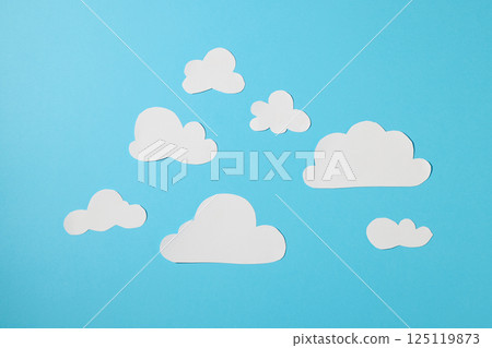 white paper clouds on blue background 125119873