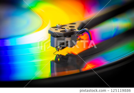 vinyl record with colorful lights reflection 125119886