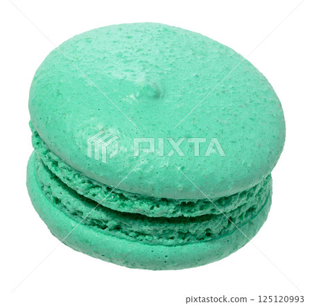 Mint green macaron with a creamy white filling, isolated background. 125120993