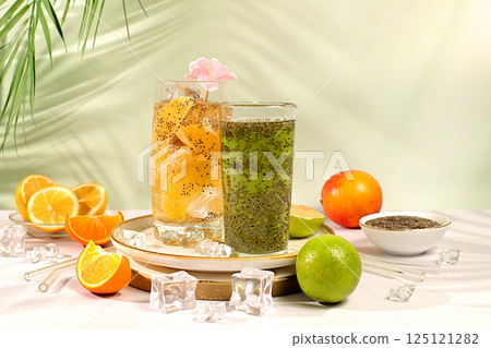 Detox diet and weight loss concept. Diet vegan cocktail with chia seeds, orange, lime, violet and ice. Summer party and healthy lifestyle advertisement. Summer banner and screen template. Detox diet and weight loss concept. Diet vegan cocktail with chia seeds, orange, lime, violet and ice. Summer party and healthy lifestyle advertisement. Summer banner and screen template. 125121282