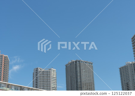 High-rise apartment complex against the blue sky 125122037