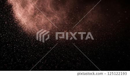 Velvet-textured powder softly spread on a dark background 125122193