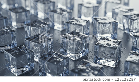 Crystal-clear ice cubes scattered with soft reflections under bright diffused light 125122287