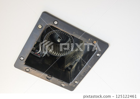 Ventilation fan being disassembled and cleaned (bathroom) 125122461