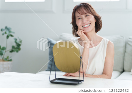 Senior woman doing skin care (beauty) 125122482