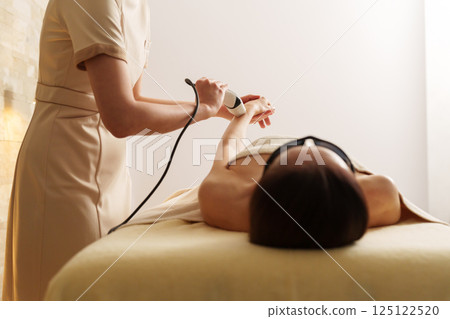 Senior woman having full body hair removal Senior woman having full body hair removal 125122520