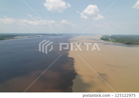 Unique merging of black and brown waters in the Amazon region Unique merging of black and brown waters in the Amazon region 125122975