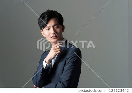 Young office worker in suit 125123442