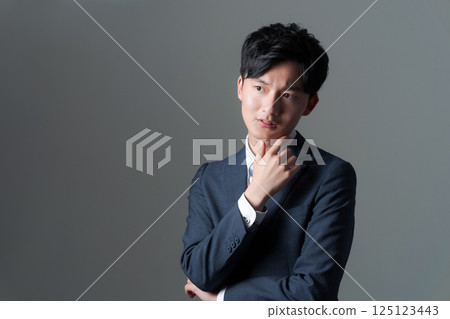 Young office worker in suit 125123443