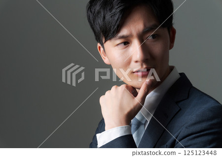Young office worker in suit 125123448
