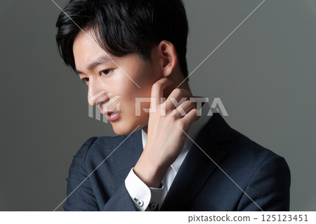 Young office worker in suit Young office worker in suit 125123451