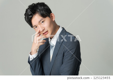 Young office worker in suit 125123455
