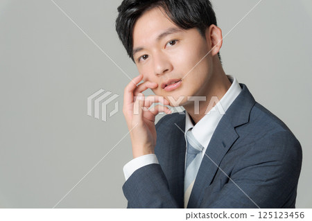 Young office worker in suit 125123456