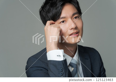Young office worker in suit Young office worker in suit 125123463