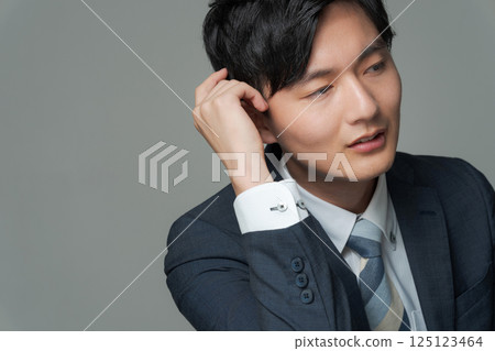 Young office worker in suit Young office worker in suit 125123464