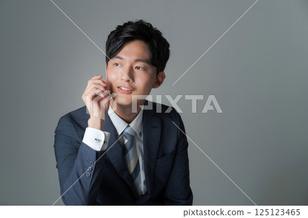 Young office worker in suit Young office worker in suit 125123465