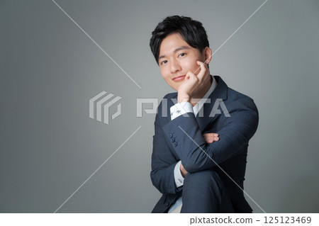 Young office worker in suit 125123469