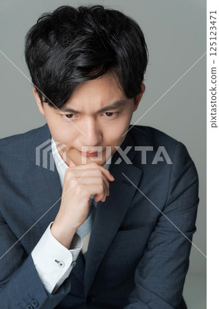 Young office worker in suit Young office worker in suit 125123471
