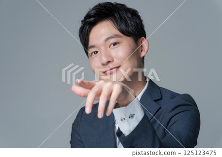 Young office worker in suit Young office worker in suit 125123475