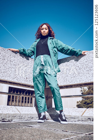 Green, designer and fashion black woman in urban city portrait pm blue sky mock up for marketing, advertising or youth promotion. Young gen z girl streetwear design clothes with mockup rooftop space 125123606