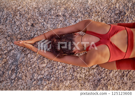 Top view, black woman and meditation to relax, workout and exercise for wellness, health and outdoor. Pose, African American girl and young female doing fitness routine, stretching and yoga training. 125123608