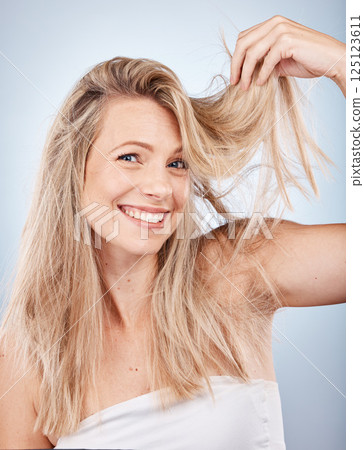 Beauty, hair care and portrait of woman in studio on gray background. Hairstyle, hair texture and female model with blonde, healthy and long hair after cosmetics or salon hair treatment for growth. 125123611