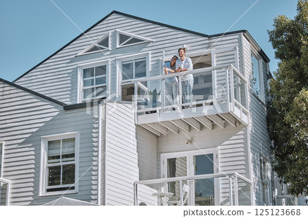 Love, couple and on balcony for vacation, holiday and in summer being happy for marriage, honeymoon and romantic. Romance, man and woman on weekend getaway, travel and bonding being loving and relax. 125123668